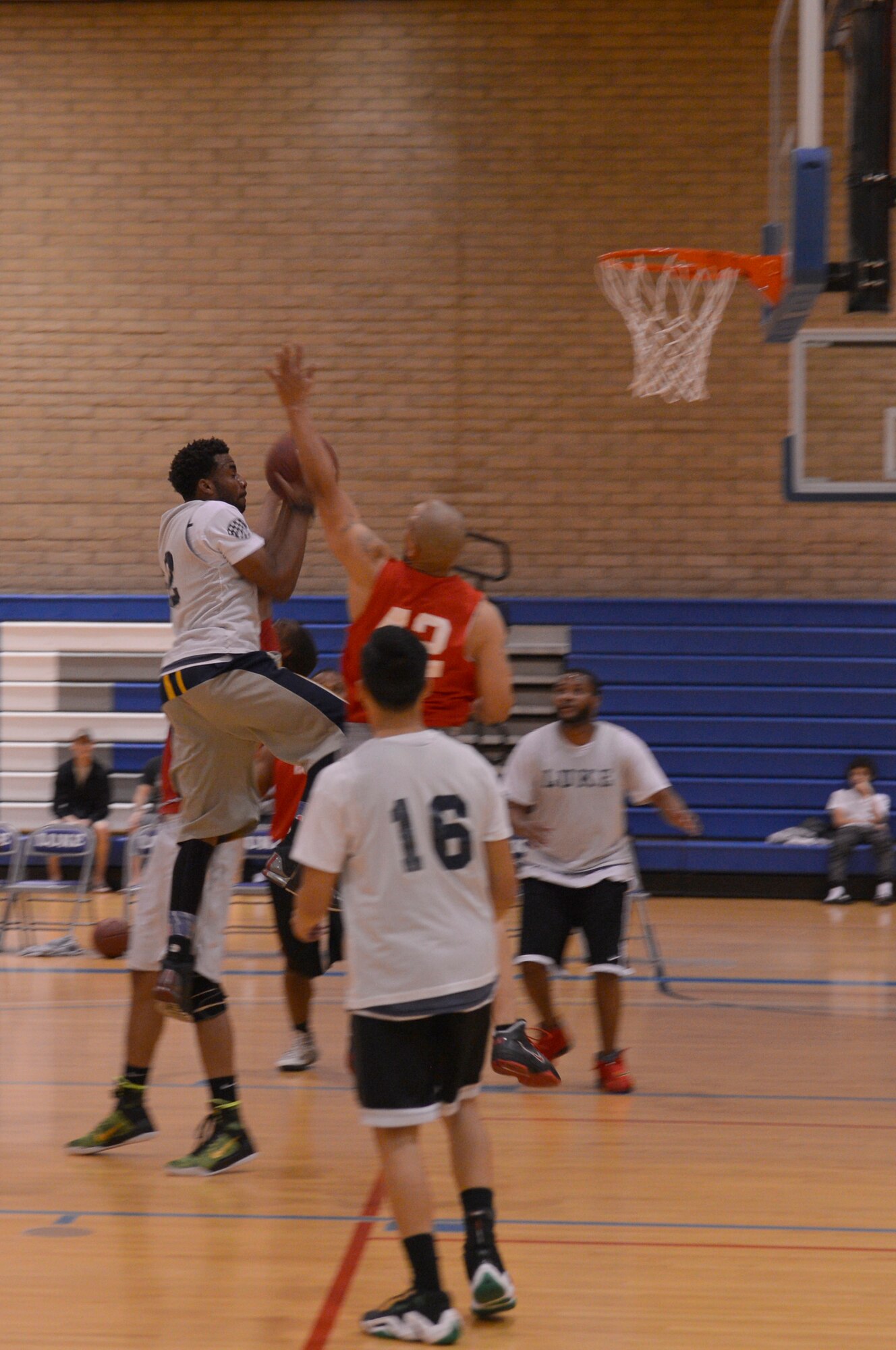 An Army, Air Force Exchange Service team member, drives for a layup. (U.S. Air Force photo/Airman Pedro Mota)