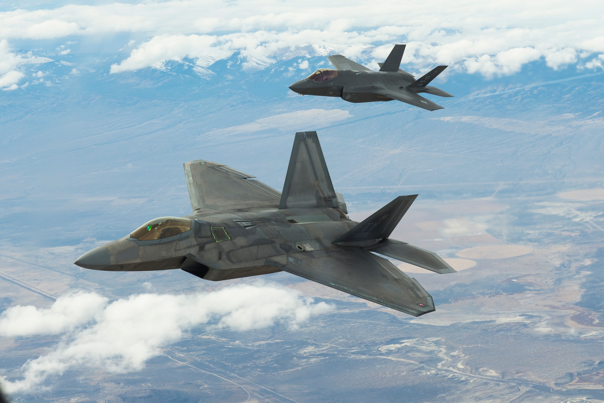 An F-22 and an F-35, flown by Air Force Reserve Command pilots from the 514th Flight Test Squadron here fly over the Utah Test and Training Range during a functional check flight approximately 75 miles west of Hill AFB.  (Air Force photo)