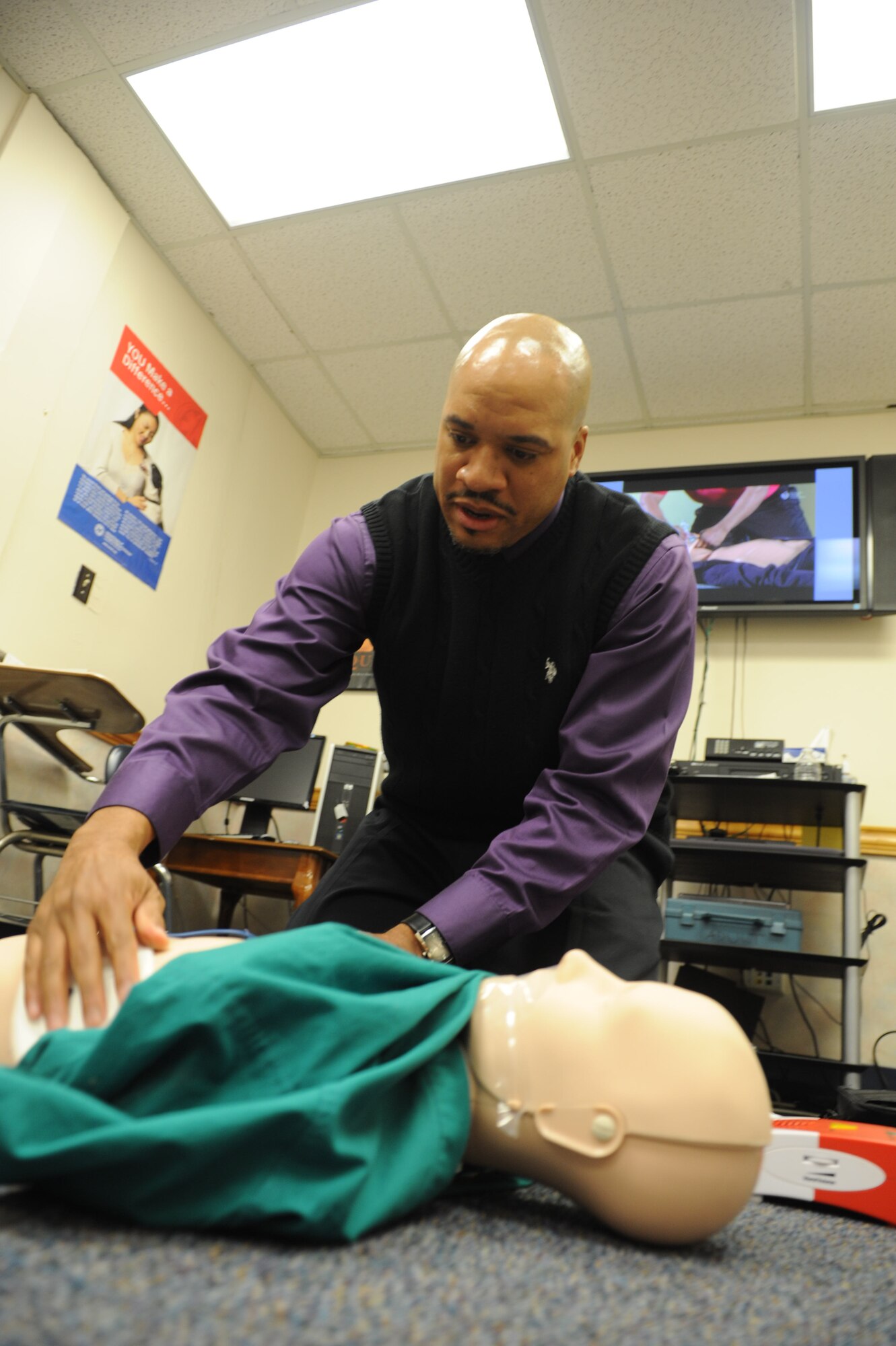 Steven Brown, Robins CPR program director, prepares his classroom for Hands-Only CPR training. The classes are available to military and civilian members of Team Robins. (U.S. Air Force photo by Tommie Horton)