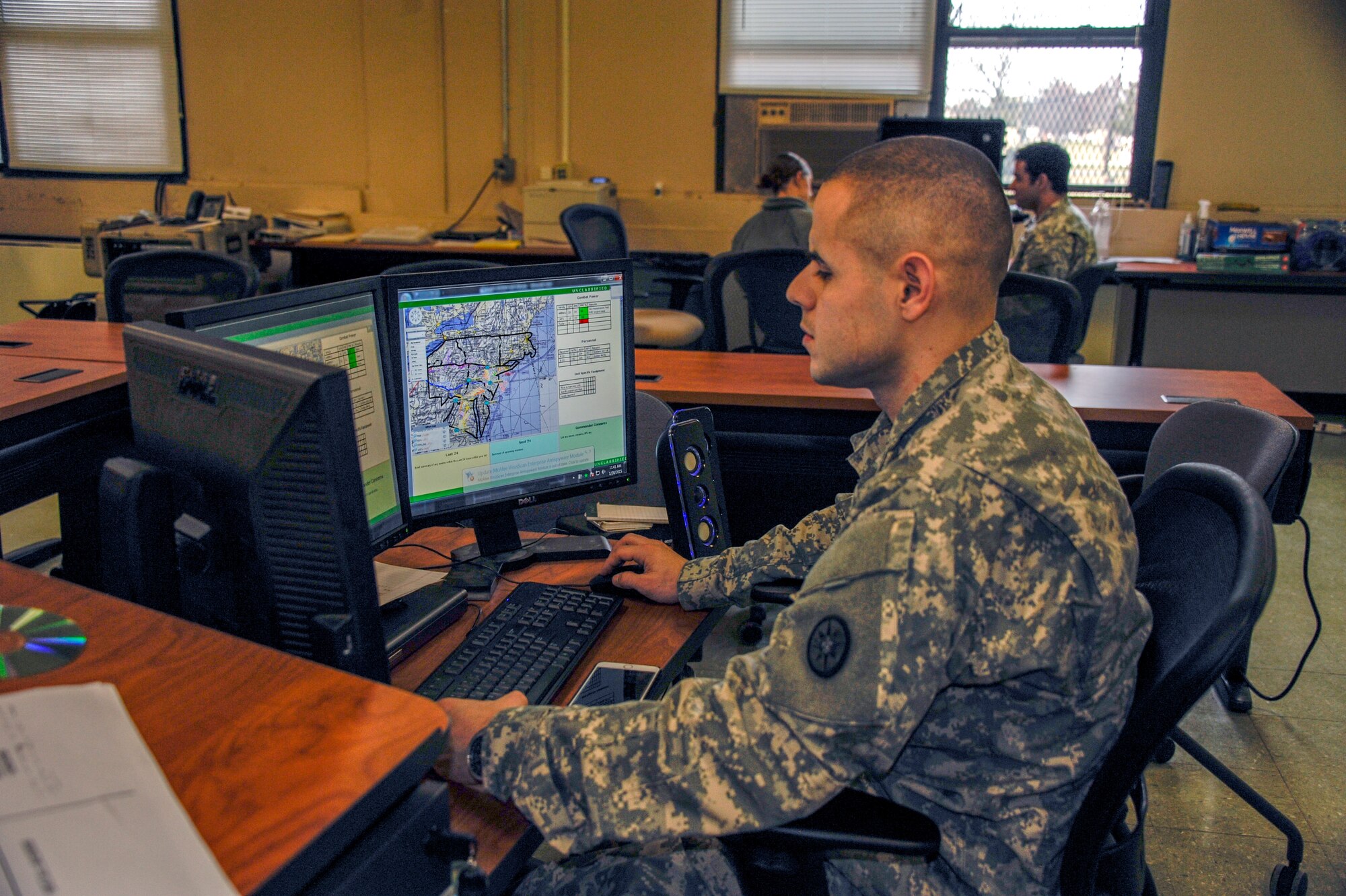 Spc. Justin Horrocas, 719th Movement Control Battalion transportation management movement specialist and native of Fall River, Massachusetts, monitors convoy movement during Warrior Exercise Artic Lightning at Joint Base McGuire-Dix-Lakehurst, New Jersey Jan. 10-31, 2015. The purpose of the training is for units to practice their technical discipline and warfighting functions while operating in a hostile environment. (U.S. Air Force photo by Pascual Flores/Released)