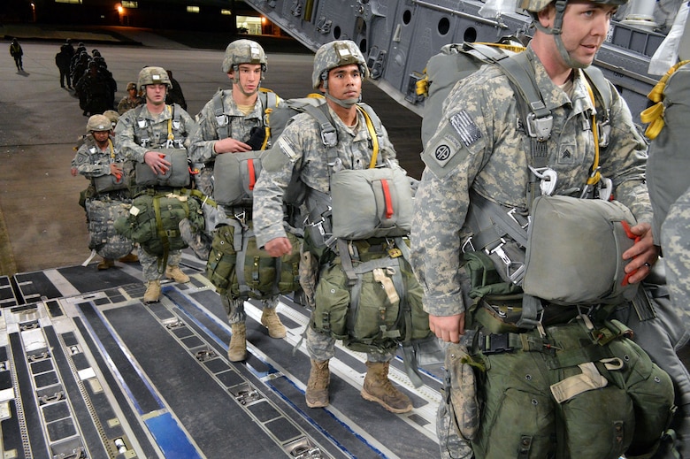 U.S. Army paratroopers from the 2nd Brigade Combat Team, 82nd Airborne Division, load onto an U.S. Air Force C-17 Globemaster III transport aircraft from the 437th Airlift Wing, Joint Base Charleston, South Carolina, on Green Ramp, Pope Army Airfield, North Carolina, Jan. 27, 2015, during an Emergency Deployment Readiness Exercise. Five hundred paratroopers were airdropped onto Wright Army Airfield, Fort Stewart, Georgia, from five C-17 transport aircraft 18 hours after notification. As the nucleus of the nation's Global Response Force, the 82nd Airborne Division provides a strategic hedge for combatant commanders with a responsive, agile and operationally significant response force that is flexible in size and composition to accomplish missions anywhere in the world. Air Mobility Command's participation also illustrates the critical partnership between Mobility Air Forces and the U.S. Army by exercising Joint Forcible Entry: the capability of rapidly introducing forces into hostile environments to conduct operations—whether combat or humanitarian support. (U.S. Air Force photo/Marvin Krause)