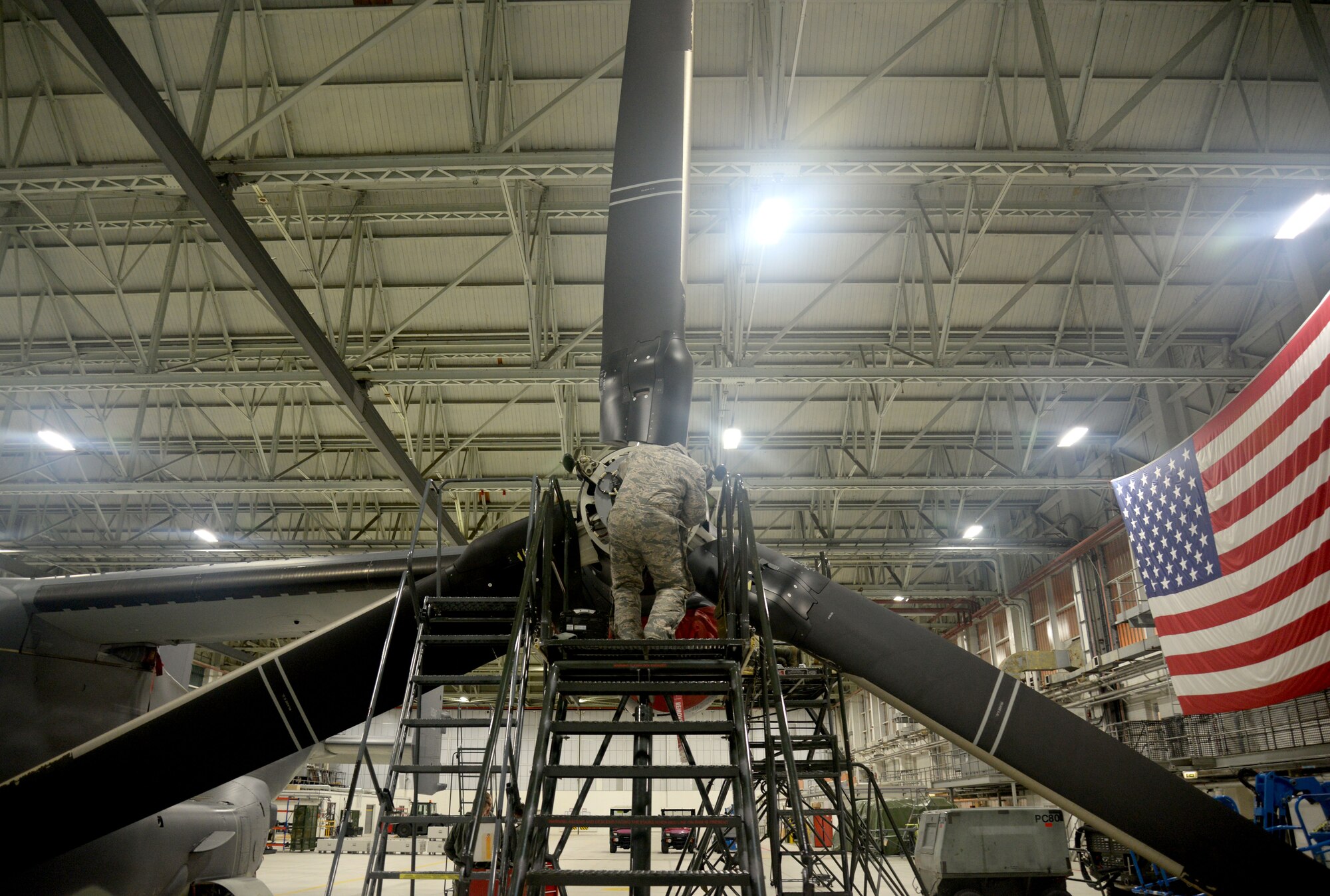U.S. Air Force Staff Sgt. Tiry Crane, 352nd Special Operations Maintenance Squadron CV-22B Osprey crew chief from Columbia, Mo., repairs a CV-22B Osprey propeller Jan. 29, 2015, on RAF Mildenhall, England. The CV-22 can perform missions that normally would require both fixed-wing and rotary-wing aircraft. Vital to the special operations mission, maintainers are prepared to fix the aircraft when necessary ensuring the Ospreys are ready to fly at all times. (U.S. Air Force photo by Senior Airman Kate Maurer/Released)
