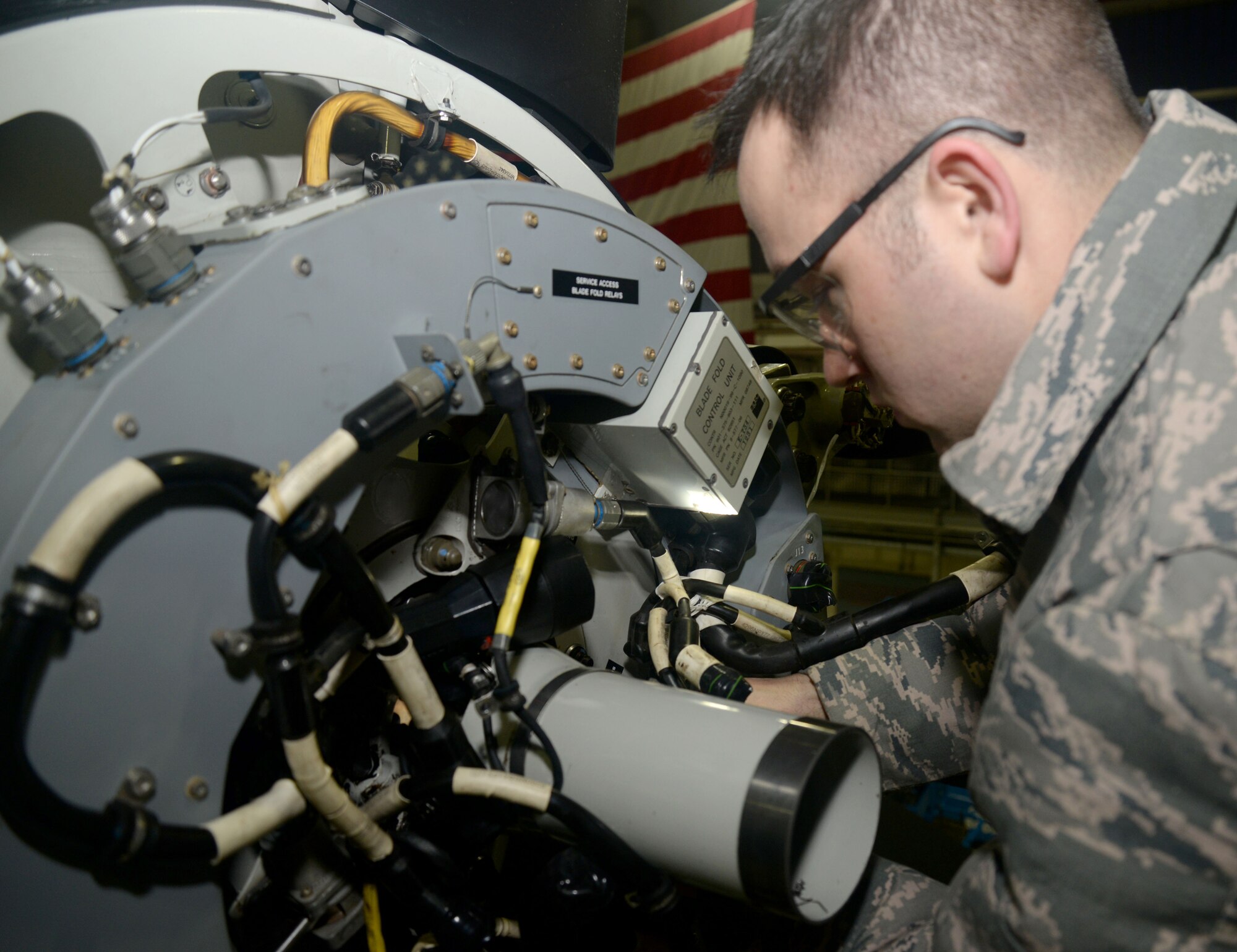U.S. Air Force Staff Sgt. Tiry Crane, 352nd Special Operations Maintenance Squadron CV-22B Osprey crew chief from Columbia, Mo., repairs a CV-22B Osprey propeller Jan. 29, 2015, on RAF Mildenhall, England. The CV-22B is a tiltrotor aircraft that combines the vertical takeoff, hover and vertical landing qualities of a helicopter with the long-range, fuel efficiency and speed characteristics of a turboprop aircraft. Its mission is to conduct long-range infiltration, exfiltration and resupply missions for special operations forces. Vital to the special operations mission, maintainers are prepared to fix the aircraft when necessary ensuring the Ospreys are ready to fly at all times. (U.S. Air Force photo by Senior Airman Kate Maurer/Released) 