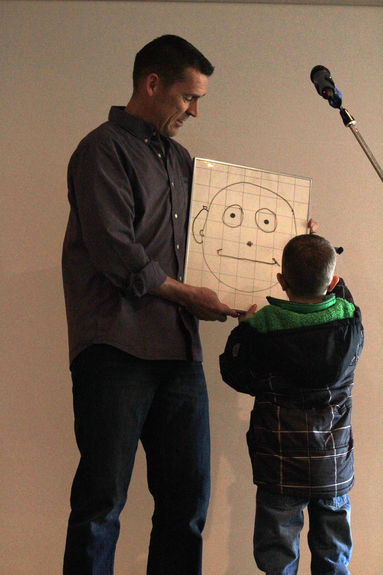 U.S. Air Force Chaplain (Maj.) Randy Croft, left, 100th Air Refueling Wing deputy chaplain from Walla Walla, Wash., takes part in a “living art” demonstration during an RAF Mildenhall Chapel Family Care retreat Jan. 25, 2015, at a holiday village in Elveden, Suffolk. Croft took up the hobby of ventriloquism when he saw “The Edgar Bergen and Charlie McCarthy Show” on TV when he was in third grade. (Courtesy photo)