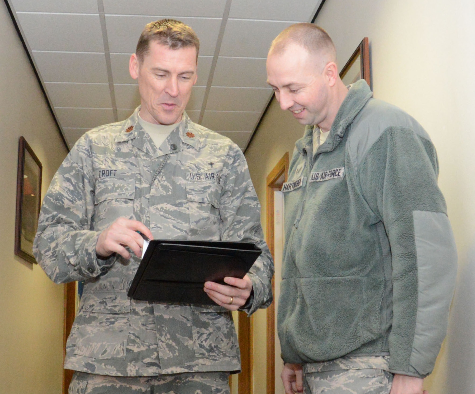 U.S. Air Force Chaplain (Maj.) Randy Croft, left, 100th Air Refueling Wing deputy chaplain from Walla Walla, Wash., speaks with U.S. Air Force Staff Sgt. Joshua Hartvigsen, 100th ARW chaplain’s assistant from Bountiful, Utah, Feb. 3, 2015, in the chapel on RAF Mildenhall, England. Chaplains and chaplain assistants often serve together, as sometimes Airmen may feel more comfortable talking to an enlisted member. (U.S. Air Force photo by Gina Randall/Released)