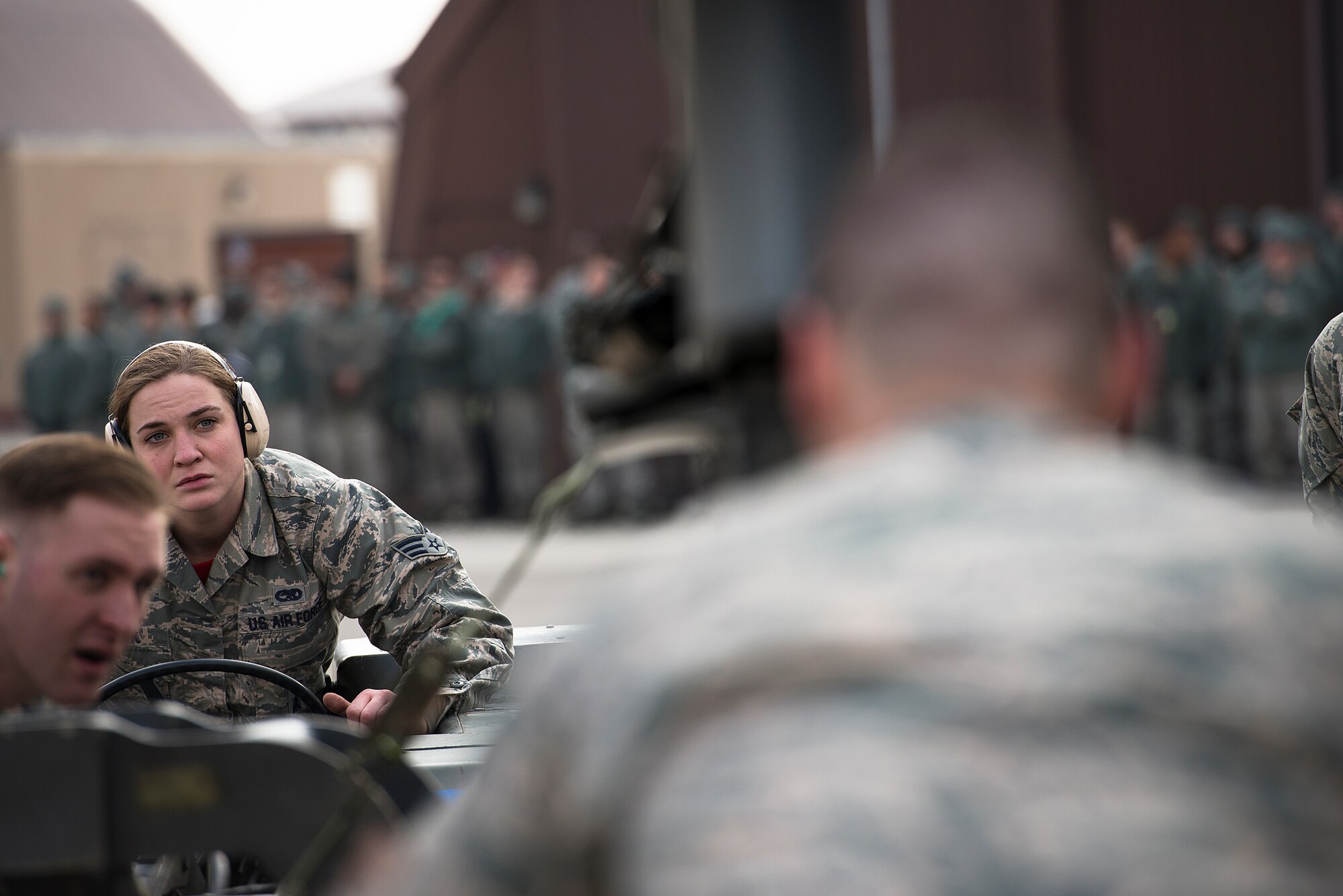 Senior Airman Theresa Nowak, 36th Aircraft Munitions Unit, guides a missile onto an F-16 during a quarterly load crew competition Feb. 6, 2015, at Osan Air Base, Republic of Korea. Load crew competition specifically practice mission readiness, which in turn produces stability, a primary principle of Osan Air Base's presence in the ROK. (U.S. Air Force photo by Staff Sgt. Jake Barreiro)