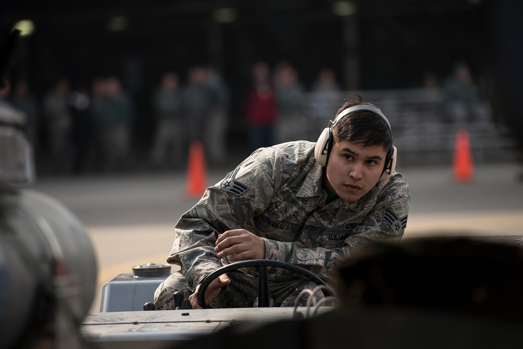 Senior Airman William Howell, 25th Aircraft Maintenance Unit, guides a missile into place on an A-10 during a quarterly load crew competition Feb. 6, 2015, at Osan Air Base, Republic of Korea. Howell and his teammates were competing against others from the 36th AMU to lay claim to title of best load crew on Osan. (U.S. Air Force photo by Staff Sgt. Jake Barreiro)