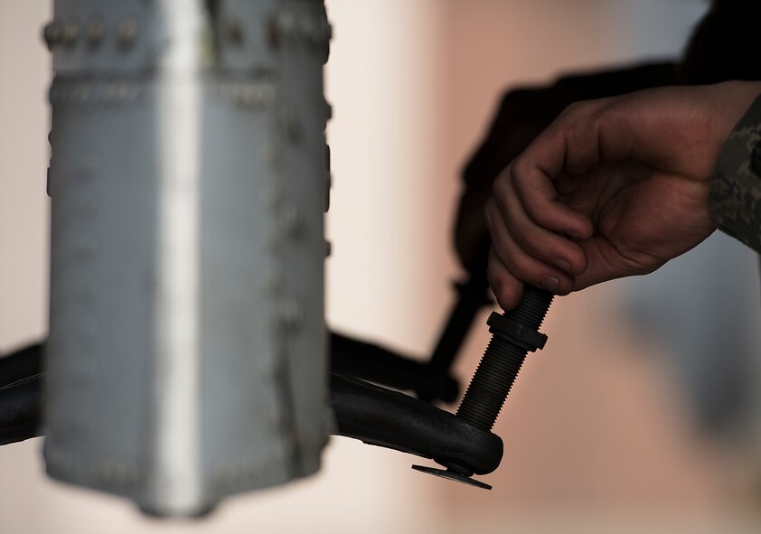 A member of the 25th Aircraft Maintenance Unit weapons load crew team works on an A-10 during a quarterly load crew competition Feb. 6, 2015, at Osan Air Base, Republic of Korea. The competition is designed to test the unit's real-world capabilities and how well they're prepared to operate in a contingency. (U.S. Air Force photo by Staff Sgt. Jake Barreiro)