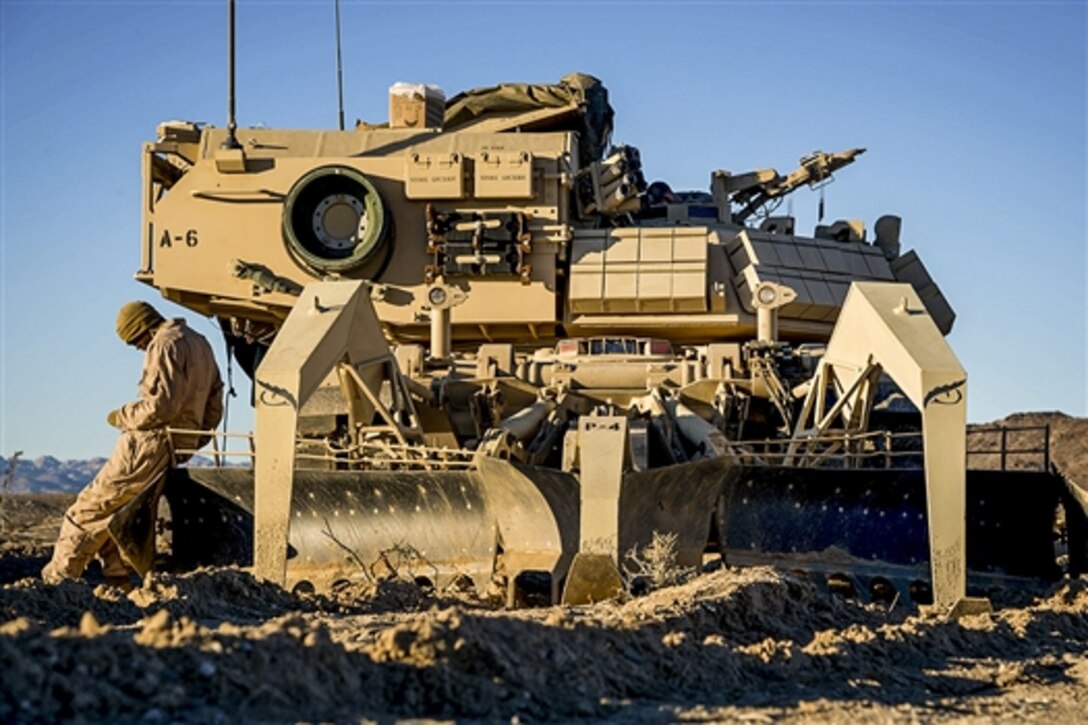 A Marine prepares an assault breacher vehicle for a mechanized assault course during Integrated Training Exercise 2-15 on Marine Corps Air Ground Combat Center in Twentynine Palms, Calif., Feb. 1, 2015. 
