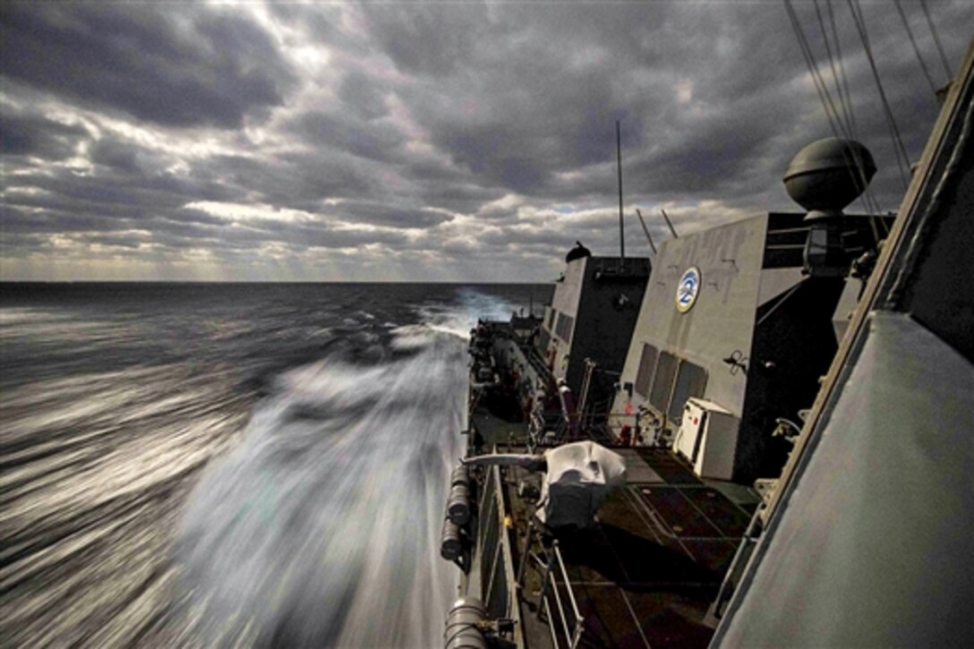 The guided-missile destroyer USS Farragut conducts an exercise in the Atlantic Ocean, Feb. 3, 2015. The Farragut is training with the Theodore Roosevelt Carrier Strike Group to prepare for deployment. 