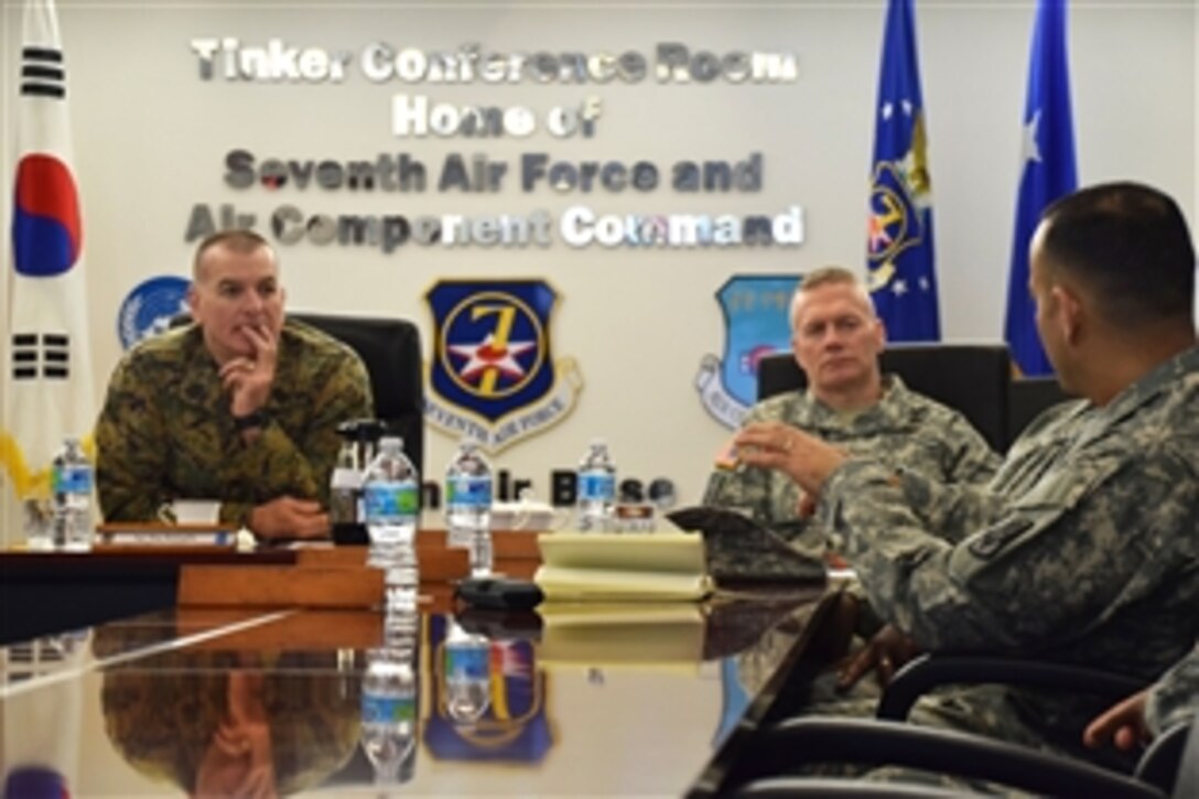 U.S. Marine Corps Sgt. Maj. Bryan Battaglia, left, senior enlisted advisor to the chairman of the Joint Chiefs of Staff, talks with U.S. Army Command Sgt. Maj. Jose Villarreal about air defense during a visit to 7th Air Force on Osan Air Base, South Korea, Feb. 6, 2015. Villarreal is the senior enlisted advisor to the 35th Air Defense Artillery Brigade.