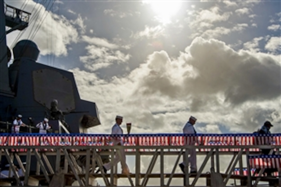 Sailors cross the brow of the guided-missile destroyer USS Halsey on Joint Base Pearl Harbor-Hickam, Hawaii, Feb. 5, 2015. The sailors returned from a seven-month deployment. 
