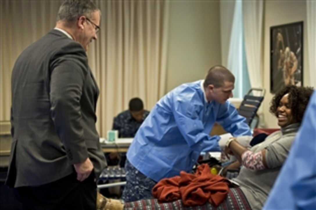 Deputy Defense Secretary Bob Work stops by the First Class Petty Officer Association blood drive at the Pentagon, Feb. 6, 2015, to thank volunteers and donors for their efforts.