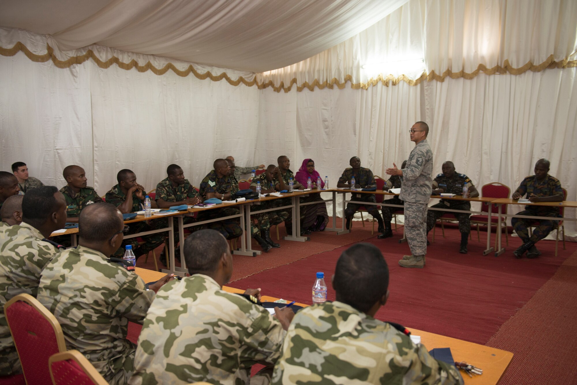 DJIBOUTI AIR BASE, Djibouti -- U.S. Air Force Senior Master Sgt. Phil Leonard, African Partnership Flight facilitator, leads a discussion of base security during African Partnership Flight on Djibouti Air Base, Djibouti, Feb. 7, 2015. The goal of the event is to discuss possible best practices of the neighboring nations and strengthen relationships among Airmen to improve regional security. (U.S. Air Force photo/Tech. Sgt. Benjamin Wilson)