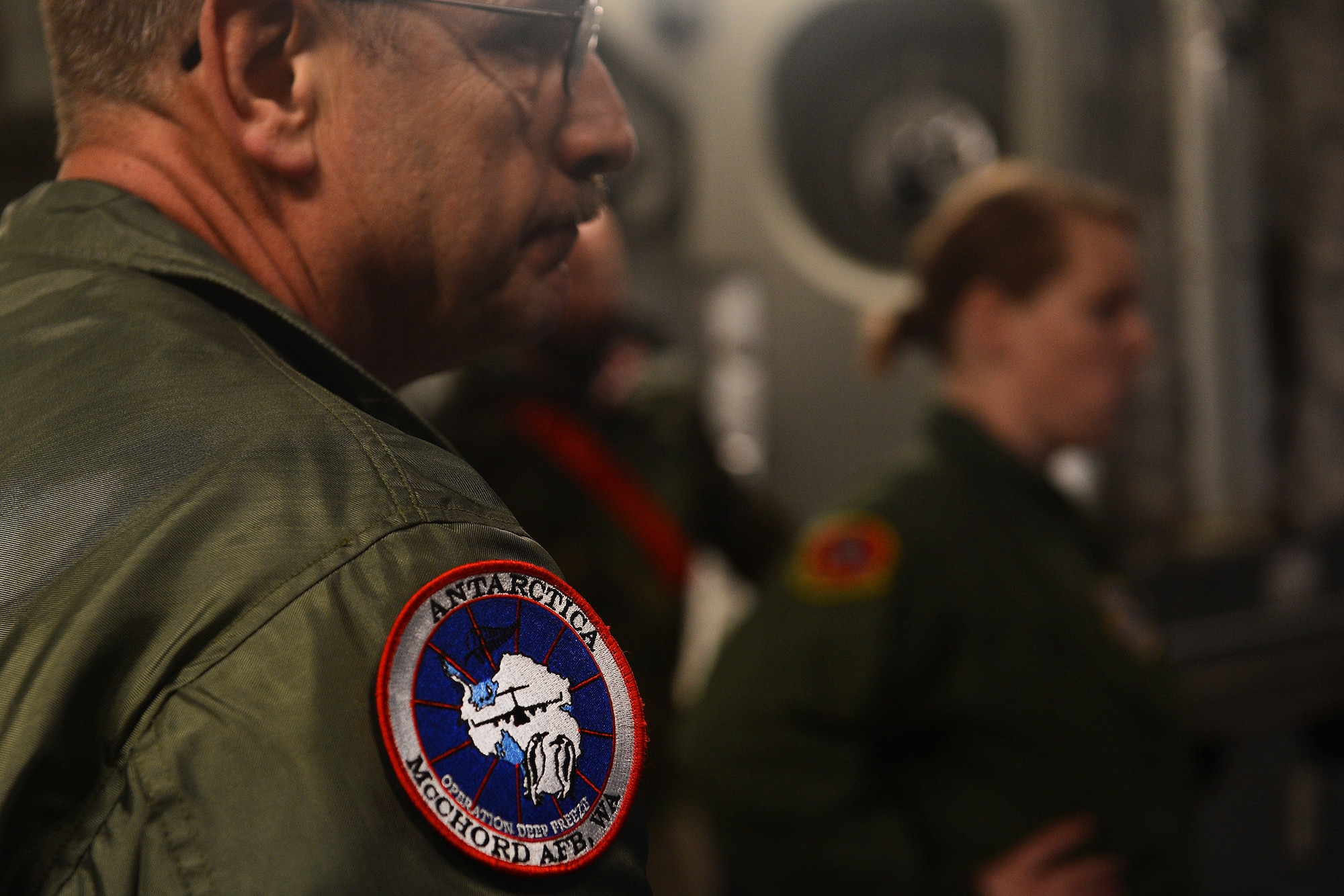 Chief Master Sgt. Ron Campeau, 446th Airlift Wing load master, loads cargo into a C-17 Globmaster III for Operation Deep Freeze Feb. 7, 2015 at Joint Base Lewis-McChord, Wash. Both the C-17 and Chief Campeau are in route to Antarctica to support the National Science Foundation. (U.S. Air Force photo\ Staff Sgt. Tim Chacon)
