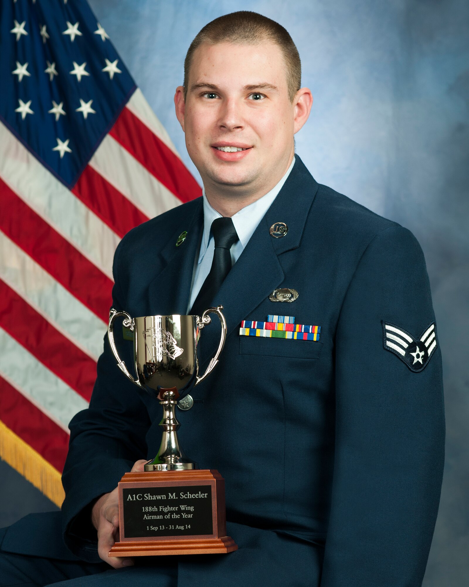 Senior Airman Shawn Scheeler poses with his 188th Wing Honor Guard Member of the Year trophy. Feist is assigned to the 123rd Intelligence Squadron. (U.S. Air National Guard photo by Senior Airman Ian Caple/released)