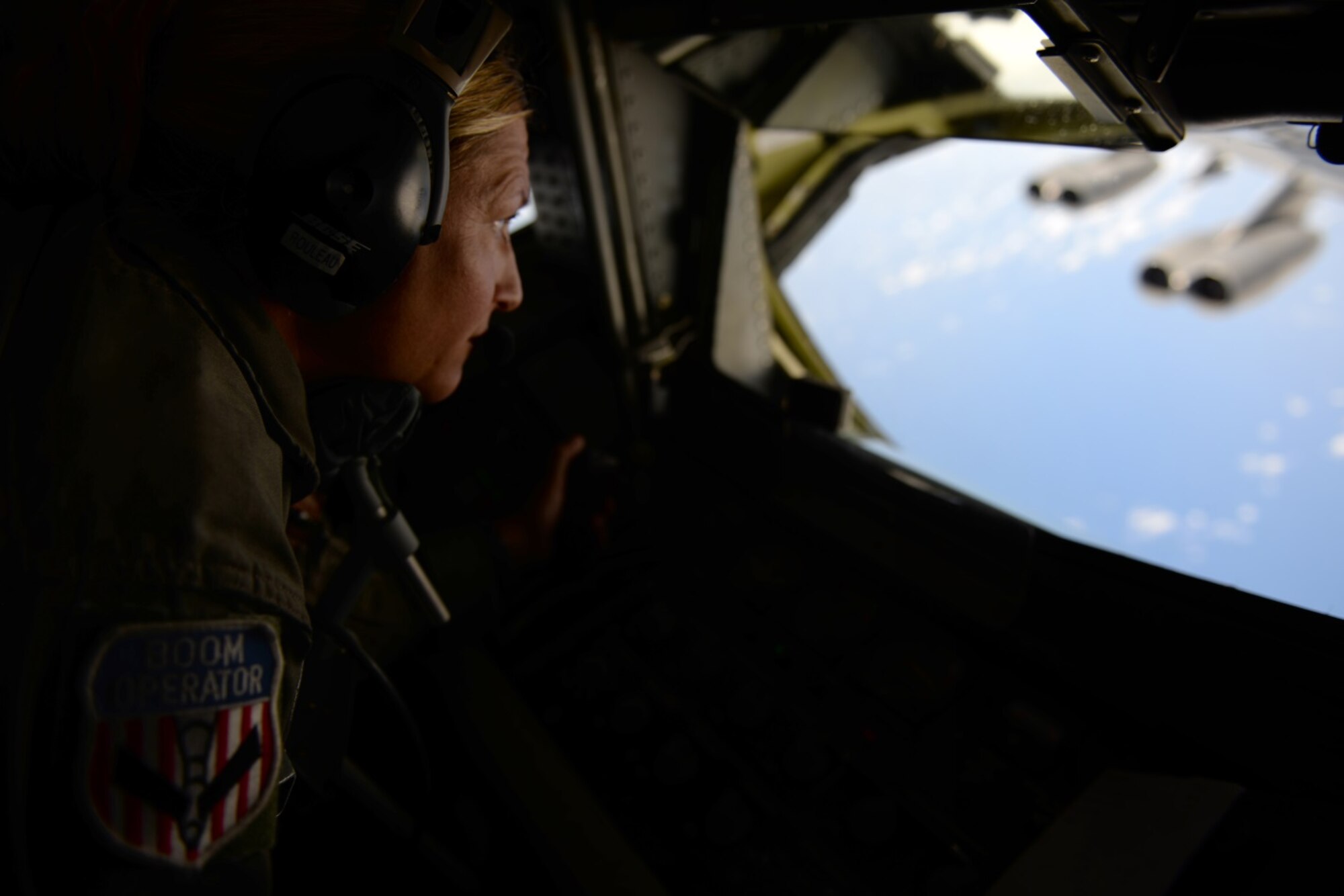 U.S. Air Force Tech. Sgt. Christie Tetley, boom operator from the 157th Air Refueling Wing, prepares a KC-135 Stratotanker from the 506th Expeditionary Air Refueling Squadron to participate in an air refueling training mission Jan. 19, 2015, over the Pacific Ocean near Andersen Air Force Base, Guam. The 157 ARW flight crew executed the training mission along with a B-52 Stratofortress operated by crew members from the 96th Expeditionary Bomb Squadron, which is deployed from Barksdale Air Force Base, L.A. (U.S. Air National Guard photo by Senior Airman Kayla McWalter/RELEASED)   