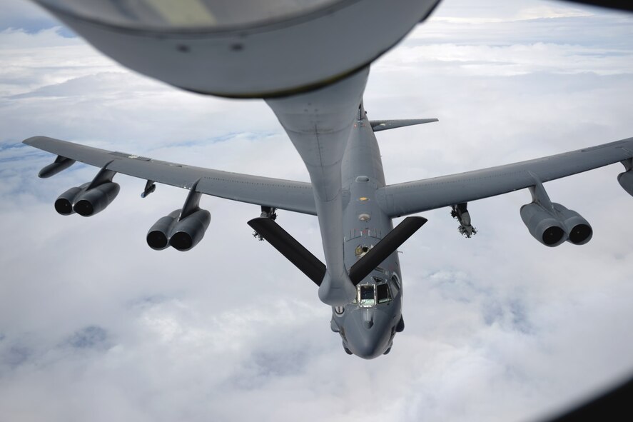 U.S. Air Force flight crew members from the 157th Air Refueling Wing, N.H. prepare a KC-135 Stratotanker from the 506th Expeditionary Air Refueling Squadron to participate in an air refueling exercise Jan. 19, 2015 over the Pacific Ocean near Andersen Air Force Base, Guam. The 157 ARW crew executes the training mission along with a B52 Stratofortress operated by crew members from the 96th Expeditionary Bomb Squadron Barksdale Air Force Base, La. (U.S. Air National Guard photo by Senior Airman Kayla McWalter) 
