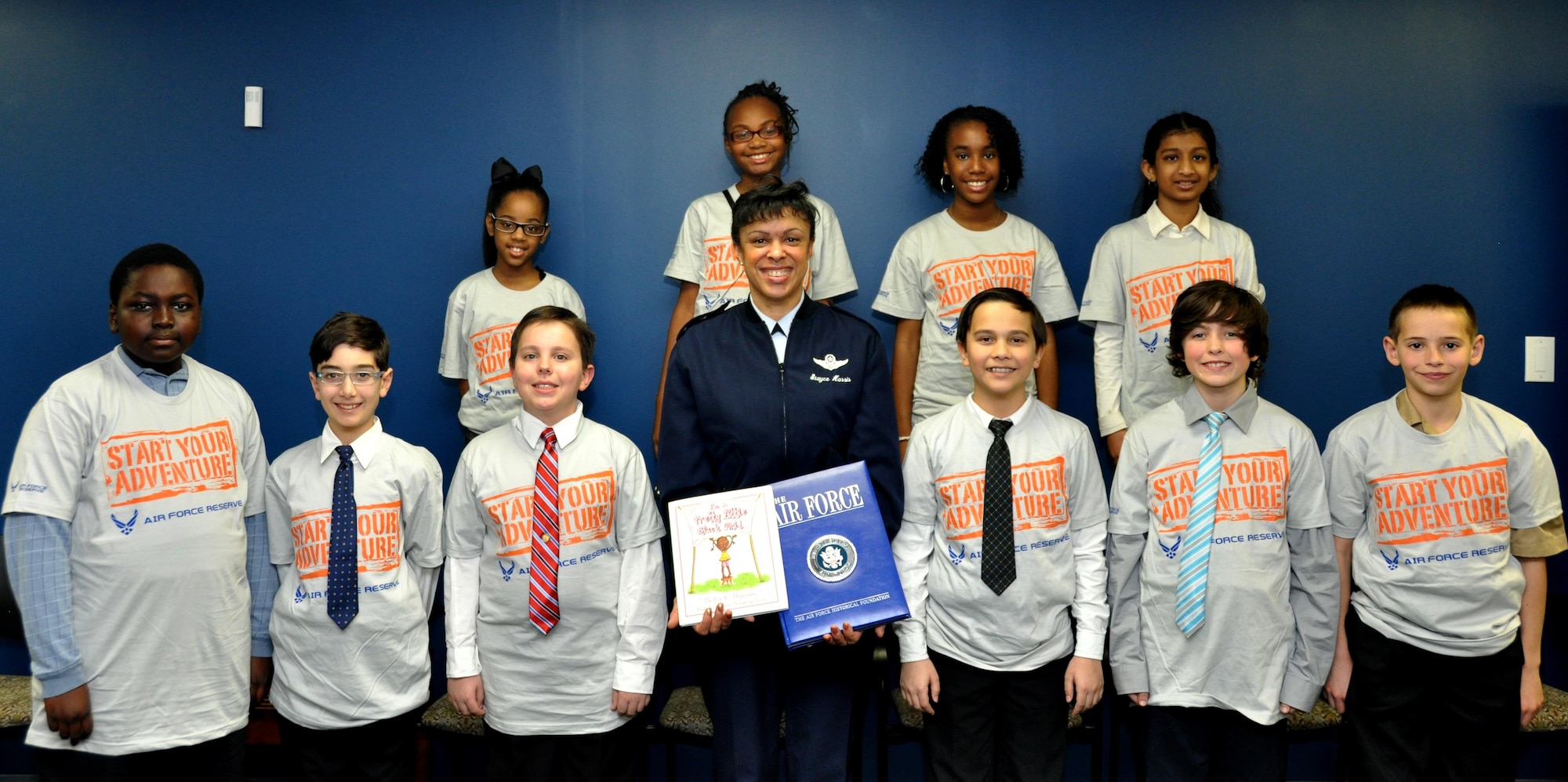 Maj. Gen. Stayce Harris, 22nd Air Force commander, poses for a photo with students from Bright Star Elementary in Douglasville, Ga. at the 22nd AF headquarters at Dobbins Air Reserve Base, Ga., Feb. 7, 2015. Ten students from Bright Star visited the installation to interview Harris for Black History month. (U.S. Air Force photo/Senior Airman Daniel Phelps)