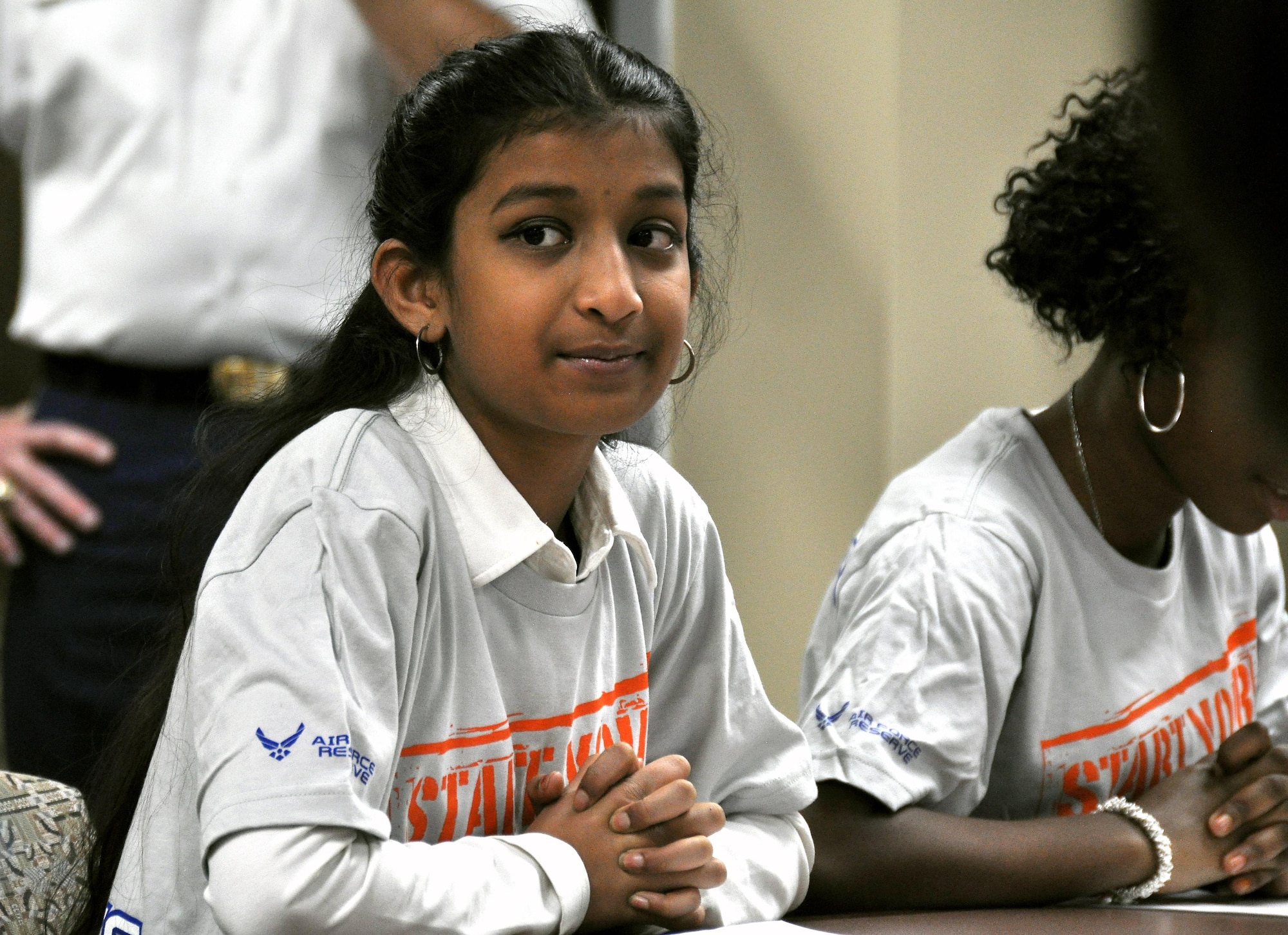 Ananya Achari, a student at Bright Star Elementary in Douglasville, Ga. listens intently to Maj. Gen. Stayce Harris, 22nd Air Force commander, at the 22nd AF headquarters at Dobbins Air Reserve Base, Ga., Feb. 7, 2015. Ten students from Bright Star visited the installation to interview Harris for Black History month. (U.S. Air Force photo/Senior Airman Daniel Phelps)