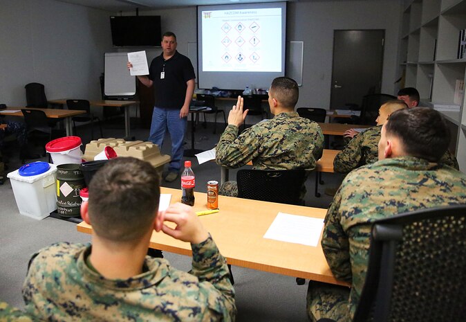 Cody Adkins, a Comprehensive Environmental Training and Education Program coordinator, speaks to a classroom of service members during the Environmental Compliance Course aboard Marine Corps Air Station Iwakuni, Japan, Feb. 4, 2015. The ECC is held biweekly in room 135 of Building 100 from 8:00 a.m. to noon and is open to anyone interested in attending. For more information, please contact the Environmental Division at 235-3388.
