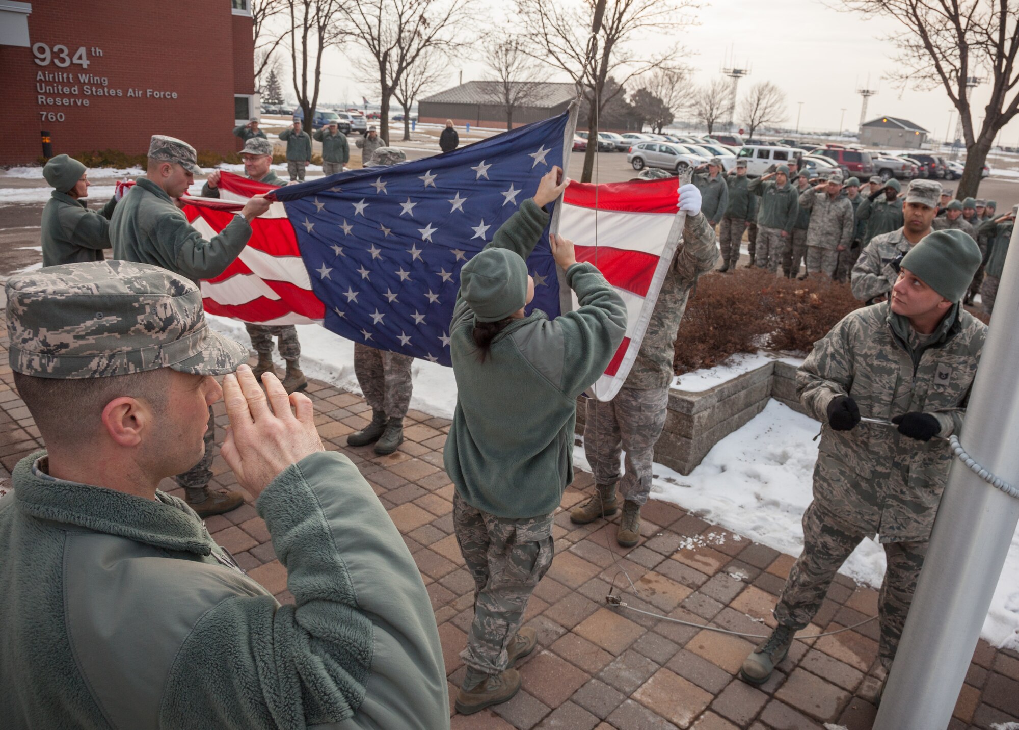 Members of the 934th Airlift Wing staff perform the retreat ceremony Saturday of the Unit Training Assembly weekend at the Minneapolis-St. Paul Air Reserve Station, Minn.  (U.S. Air Force photo by Shannon McKay/Released)