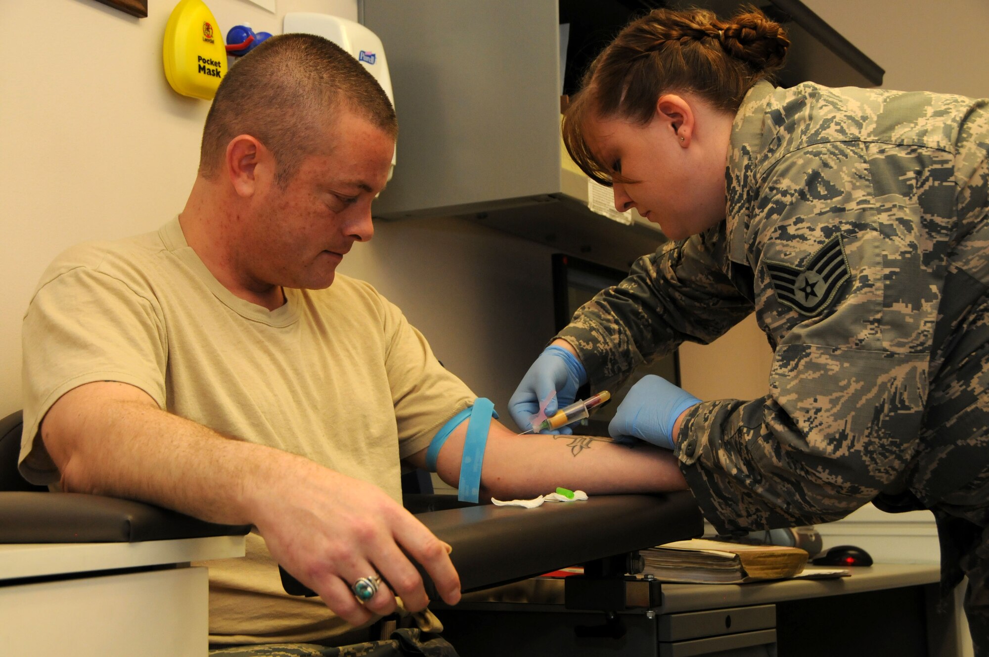 U.S. Air Force Tech. Sgt. Matthew Comiskey, 114th Fighter Squadron, gets his blood drawn by Staff Sgt. Jessica Bridges, 173rd Fighter Wing Medical Group Lab Technologist, to complete one of his individual medical readiness requirements at Kingsley Field, Ore., Feb 7, 2015. Currently, the 173rd FW is maintaining an overall individual medical readiness rate higher than the total Air National Guard and Active Duty counterparts. (U.S. Air National Guard photo by Senior Airman Penny Snoozy/Released)

