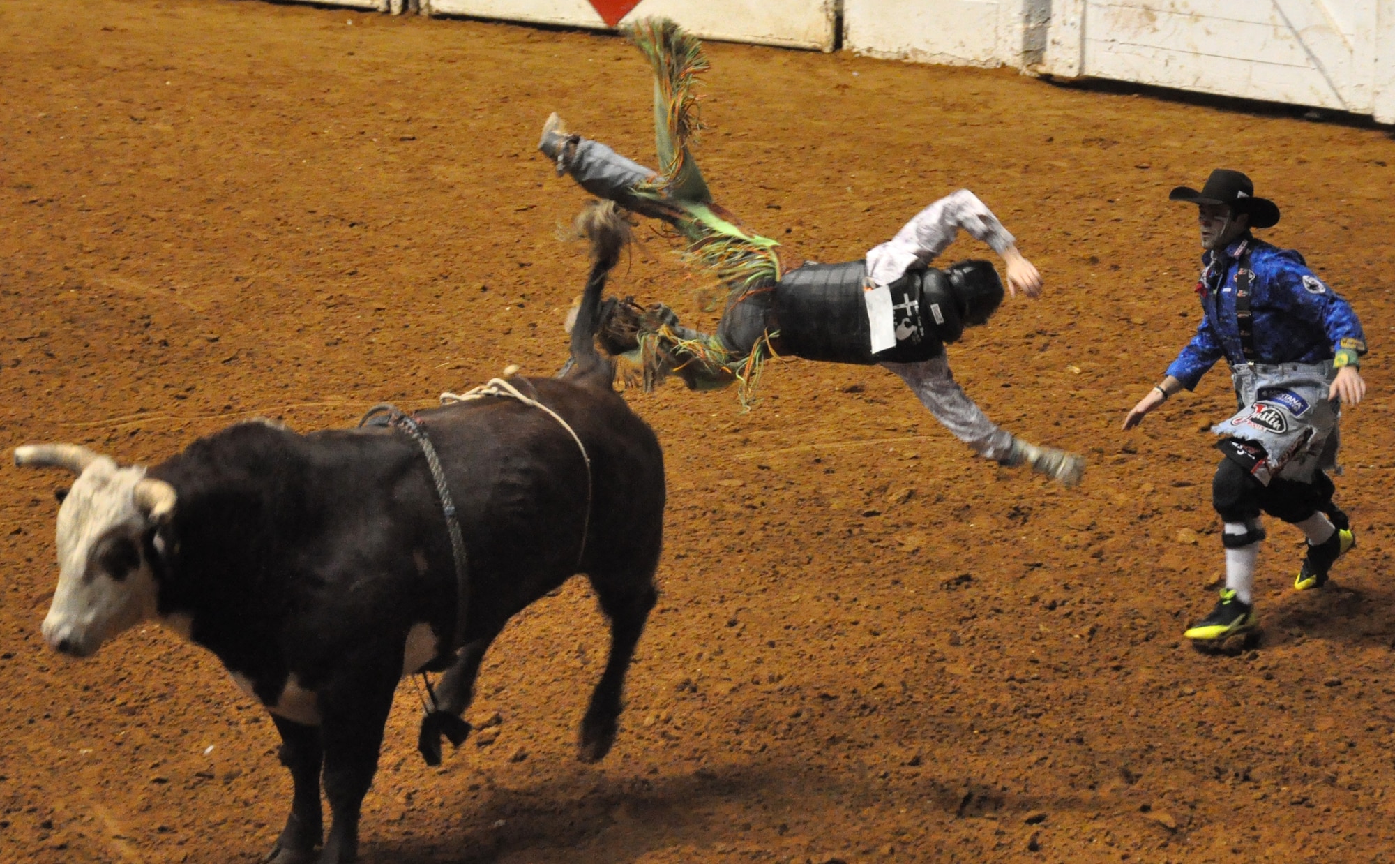 It’s the rodeo clown’s duty to protect this cowboy at all cost when thrown from his bull Feb. 2 at the Fort Worth Stock Show and Rodeo. The event is a 23-day show featuring seven specialty rodeos and 1,200 professional cowboy and cowgirl athletes competing for championship titles. (U.S. Air Force photo/Master Sgt. Julie Briden-Garcia)