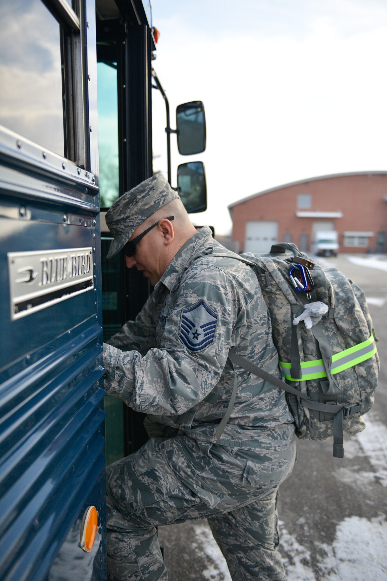 Master Sgt. Eric Amidon, 27th Aerial Port, loads the bus as he departs for a deployment. Members of 27 APS deployed February 7 for mission support in Southwest Asia. (U.S. Air Force photo by Staff Sgt. Corban Lundborg/Released)