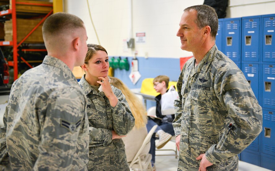 Col. Robert Graham, 934th Airlift Wing vice commander, and Senior Airman Brandi Tepe, 27th Aerial Port Squadron, bid farewell to Airman 1st Class Derek Spencer as he prepares for a deployment. Members of 27 APS deployed February 7 for mission support in Southwest Asia.  (U.S. Air Force photo by Staff Sgt. Corban Lundborg/Released)