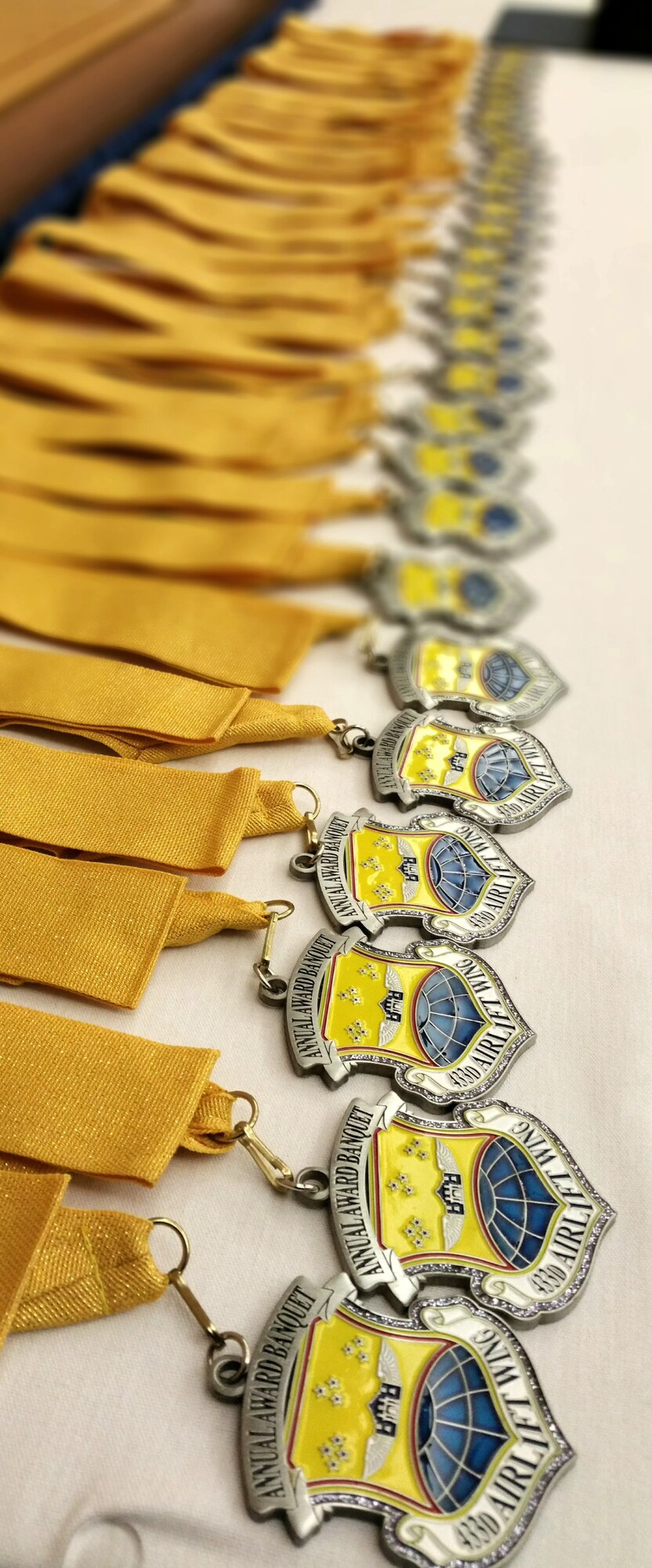 433rd Airlift Wing medallions were awarded to quarterly award winners prior to the Annual Awards Banquet. More than 300 Airmen, honorary commanders and guests attended the 433rd Airlift Wing’s fourth Annual Awards Banquet at the Gateway Club, Joint Base San Antonio-Lackland, Feb.8, 2015. The event was hosted by the 443rd Airlift Wing First Sergeants Council. (U.S. Air Force by Tech. Sgt. Carlos J. Trevino)
