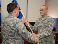 Maj. Terrell Eikner accepts the 919th Special Operations Aircraft Maintenance Squadron guidon during his assumption of command ceremony Feb. 7 at Duke Field, Fla.  (U.S. Air Force photo/Tech. Sgt. Cheryl Foster)
