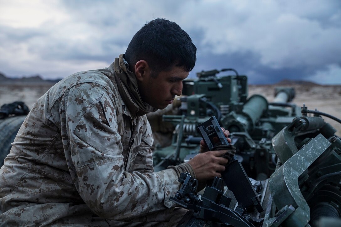Lance Cpl. Christian J. Hernandez cleans the breach of a M777A2 lightweight 155 mm howitzer Jan. 30 at Marine Air Ground Combat Center Twentynine Palms during Integrated Training Exercise 2-15 to keep the weapon firing properly. The howitzer is capable of firing high explosive, illuminating, smoke and satellite guided rounds. Hernandez, a Buford, Georgia, native, is a cannoneer with Alpha Battery, 1st Battalion, 12th Marine Regiment, currently assigned to 3rd Battalion, 12th Marines, 3rd Marine Division, III Marine Expeditionary Force for ITX 2-15 as part of the ground combat element of Special Purpose Marine Air-Ground Task Force 4. 