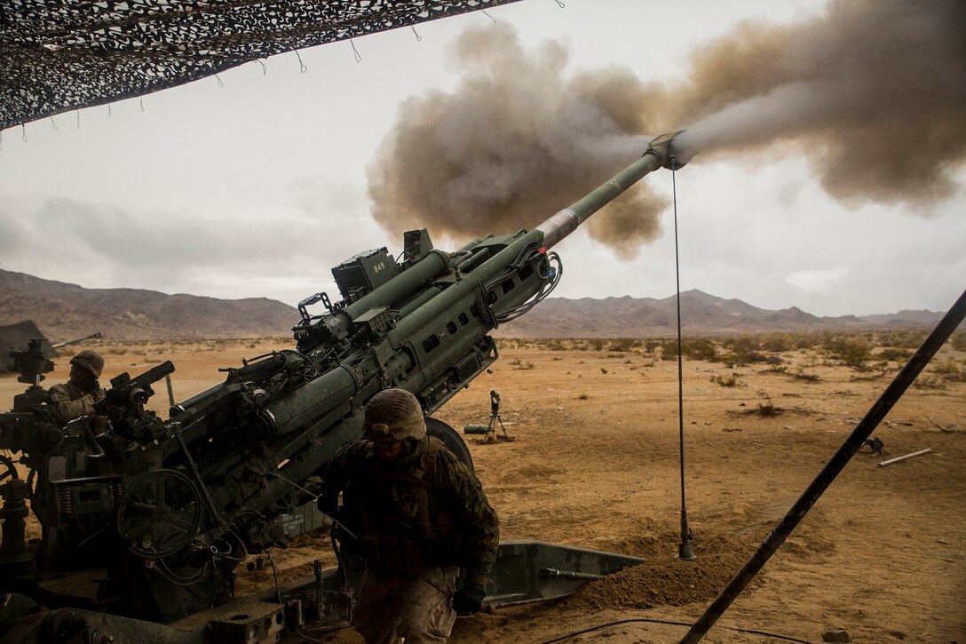 Smoke explodes out of the M777A2 lightweight 155 mm howitzer as Marines from Alpha Battery provide indirect fire to units engaged in the mechanized assault course Jan. 31 at Marine Air Ground Combat Center Twentynine Palms during Integrated Training Exercise 2-15. Artillery is used to provide suppressive, indirect fire to ground and air units on the battlefield. The Marines are with Alpha Battery, 1st Battalion, 12th Marine Regiment, currently assigned to 3rd Battalion, 12th Marines, 3rd Marine Division, III Marine Expeditionary Force as part of the ground combat element for  Special Purpose Marine Air-Ground Task Force 4 for ITX 2-15. 