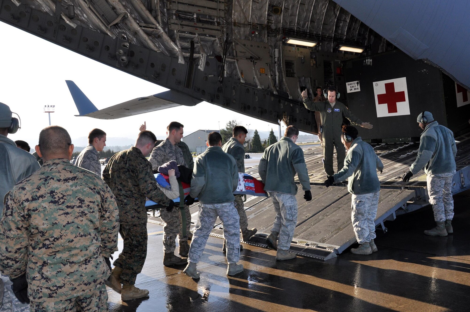 RAMSTEIN AIR BASE, Germany – Members of the 86th Contingency Aeromedical Staging Facility at Ramstein Air Base load wounded warriors aboard a 445th Airlift Wing C-17 Globemaster III bound for Joint Base Andrews, Maryland, Jan. 4, 2015. (U.S. Air Force photo/Capt. Elizabeth Caraway)
