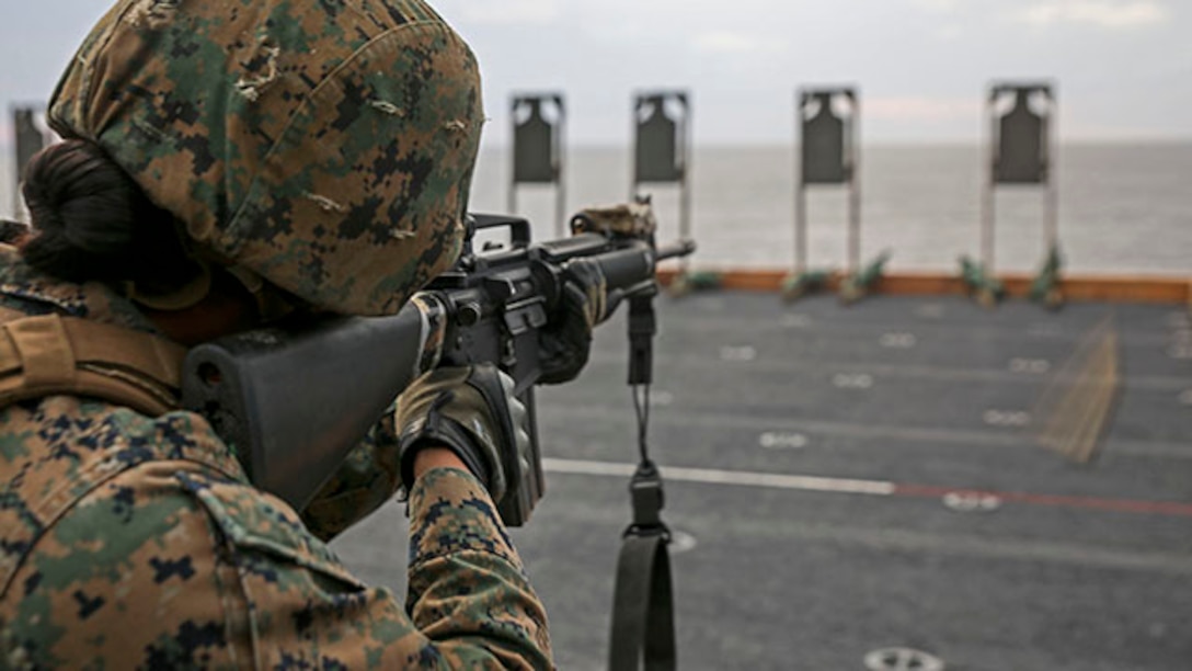 U.S. Marine Cpl. Mayte Rincon fires her M16 rifle during a live-fire exercise Feb. 4 on the flight deck of the USS Bonhomme Richard. This was her first time shooting aboard a ship and she fired 30 rounds during multiple drills. Rincon, from Salinas, California, is a landing support specialist with Combat Logistics Battalion 31, 31st Marine Expeditionary Unit. The Marines are currently underway in support of the regularly scheduled Spring Patrol of the Asia-Pacific region. (U.S. Marine Corps photo by Lance Cpl. Ryan C. Mains /Released)