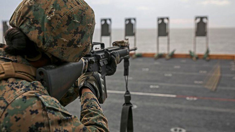 U.S. Marine Cpl. Mayte Rincon fires her M16 rifle during a live-fire exercise Feb. 4 on the flight deck of the USS Bonhomme Richard. This was her first time shooting aboard a ship and she fired 30 rounds during multiple drills. Rincon, from Salinas, California, is a landing support specialist with Combat Logistics Battalion 31, 31st Marine Expeditionary Unit. The Marines are currently underway in support of the regularly scheduled Spring Patrol of the Asia-Pacific region. (U.S. Marine Corps photo by Lance Cpl. Ryan C. Mains /Released)