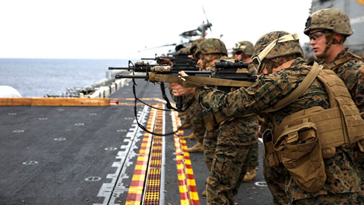 U.S. Marines execute a live-fire exercise Feb. 4 on the flight deck of the USS Bonhomme Richard. During the exercise, the Marines were given 30 rounds and executed multiple firing drills. The Marines are with Combat Logistics Battalion 31, 31st Marine Expeditionary Unit, and are currently underway as part of the regularly scheduled Spring Patrol of the Asia-Pacific region. (U.S. Marine Corps photo by Lance Cpl. Ryan C. Mains /Released)