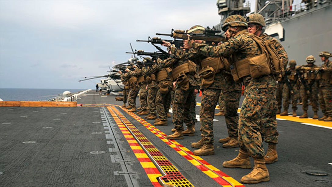 U.S. Marines shoot their M16 rifles during a live-fire exercise Feb. 4 on the flight deck of the USS Bonhomme Richard. Each Marine fired 30 rounds during multiple drills. The Marines are with Combat Logistics Battalion 31, 31st Marine Expeditionary Unit, and are currently underway as part of the regularly scheduled Spring Patrol of the Asia-Pacific region. (U.S. Marine Corps photo by Lance Cpl. Ryan C. Mains/Released)