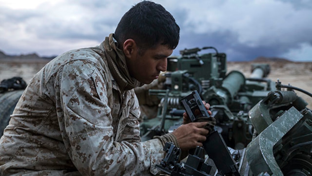 Lance Cpl. Christian J. Hernandez cleans the breach of a M777A2 lightweight 155 mm howitzer Jan. 30 at Marine Air Ground Combat Center Twentynine Palms during Integrated Training Exercise 2-15 to keep the weapon firing properly. The howitzer is capable of firing high explosive, illuminating, smoke and satellite guided rounds. Hernandez, a Buford, Georgia, native, is a cannoneer with Alpha Battery, 1st Battalion, 12th Marine Regiment, currently assigned to 3rd Battalion, 12th Marines, 3rd Marine Division, III Marine Expeditionary Force for ITX 2-15 as part of the ground combat element of Special Purpose Marine Air-Ground Task Force 4. (U.S. Marine Corps photo by Lance Cpl. William Hester/ Released)