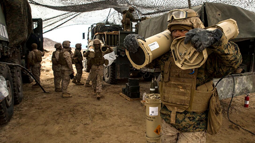 Cpl. Armontey D. Parks carries charges for the M777A2 lightweight 155 mm howitzer Jan. 31 at Marine Air Ground Combat Center Twentynine Palms during Integrated Training Exercise 2-15. Different charges are used to adjust the distance the round will travel. Parks, a Saginaw, Michigan, native, is a cannoneer with Alpha Battery, 1st Battalion, 12th Marine Regiment, currently assigned to 3rd Battalion, 12th Marines, 3rd Marine Division, III Marine Expeditionary Force as part of the ground combal element of Special Purpose Marine Air-Ground Task Force 4 for ITX 2-15. (U.S. Marine Corps photo by Lance Cpl. William Hester/ Released)