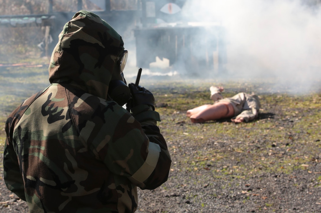 Marines from Marines Forces Reserve practice how to properly report a casualty and possible toxic gas during a chemical, biological, radiological and nuclear defense training simulation aboard Naval Air Station Joint Reserve Base New Orleans, Feb. 5, 2015. When they locate a casualty, Marines must report it to the control center and wait for further instructions. The CBRN defense training equips Marines from diverse units, with the proper knowledge and readiness needed to handle a real combat zone situation.  (U.S. Marine Corps photo by Lance Cpl. Ian Ferro)