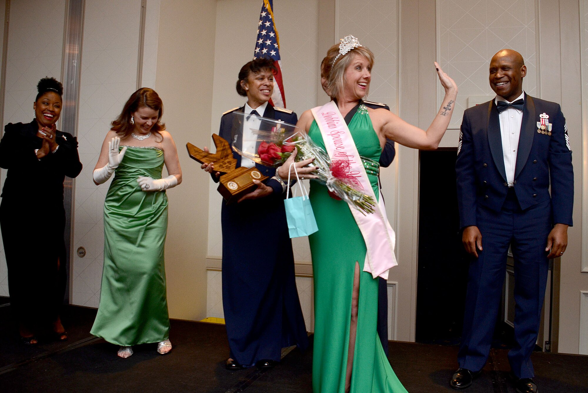 Corbie Pierce, wife of Master Sgt. Jeff Pierce, from the 94th Maintenance Squadron, receives her recognition as the winner of the 2014 Spouse of the Year award at the First Annual Dobbins Recognition Ceremony held in Marietta, Ga., Feb. 7, 2015. The ceremony recognized individuals who demonstrated the capability to excel, and present themselves as the best of 2014. (U.S. Air Force photo/Don Peek)