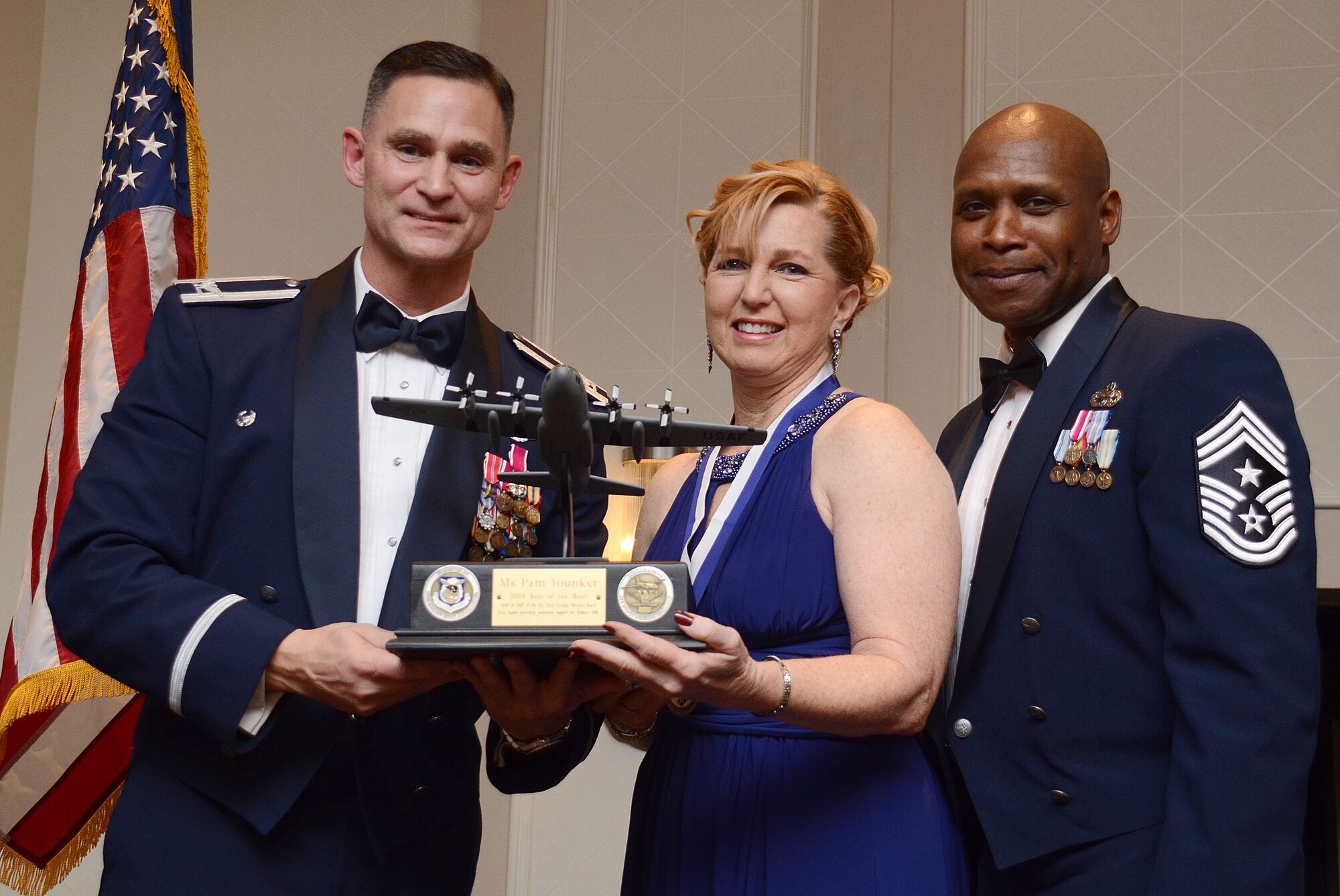 Pam Younker from the Community Outreach Government and Community Affairs program, receives the award as “Best of the Best” from Col. Brett Clark, 94th Airlift Wing , commander and Chief Master Sgt. Lyndon Tubbs, 94th Airlift Wing, Command Chief during the First Annual Dobbins Recognition Ceremony held in Marietta, Ga. Feb. 7, 2015. Younker was recognized for her continuing efforts to encourage local employers support employees who are members of the Guard and Reserves. The ceremony recognized individuals who demonstrated the capability to excel, and present themselves as the best of 2014.  (U.S. Air Force photo/Don Peek)