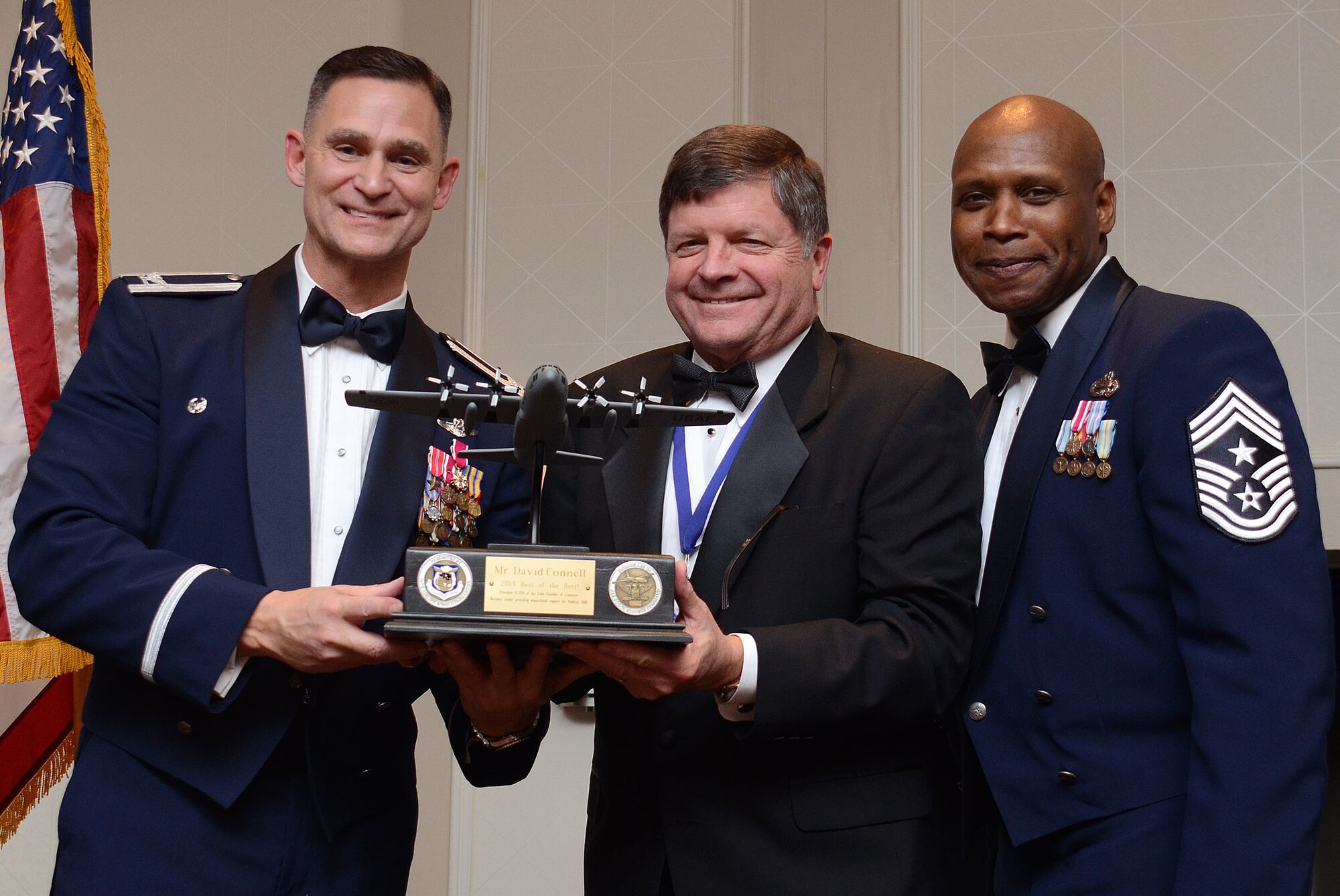 David Connell from the Community Outreach Government and Community Affairs program, receives the award as “Best of the Best” from Col. Brett Clark, 94th Airlift Wing , commander and Chief Master Sgt. Lyndon Tubbs, 94th Airlift Wing, Command Chief during the First Annual Dobbins Recognition Ceremony held in Marietta, Ga. Feb. 7, 2015. Connell was recognized for his continuing efforts to encourage local employers support employees who are members of the Guard and Reserves. The ceremony recognized individuals who demonstrated the capability to excel, and present themselves as the best of 2014. (U.S. Air Force photo/Don Peek)