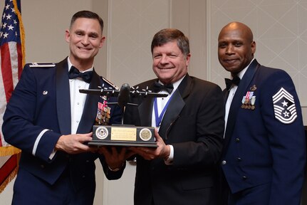 David Connell from the Community Outreach Government and Community Affairs program, receives the award as “Best of the Best” from Col. Brett Clark, 94th Airlift Wing , commander and Chief Master Sgt. Lyndon Tubbs, 94th Airlift Wing, Command Chief during the First Annual Dobbins Recognition Ceremony held in Marietta, Ga. Feb. 7, 2015. Connell was recognized for his continuing efforts to encourage local employers support employees who are members of the Guard and Reserves. The ceremony recognized individuals who demonstrated the capability to excel, and present themselves as the best of 2014. (U.S. Air Force photo/Don Peek)