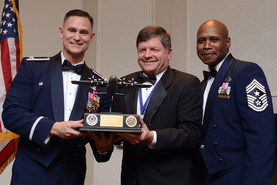 David Connell from the Community Outreach Government and Community Affairs program, receives the award as “Best of the Best” from Col. Brett Clark, 94th Airlift Wing , commander and Chief Master Sgt. Lyndon Tubbs, 94th Airlift Wing, Command Chief during the First Annual Dobbins Recognition Ceremony held in Marietta, Ga. Feb. 7, 2015. Connell was recognized for his continuing efforts to encourage local employers support employees who are members of the Guard and Reserves. The ceremony recognized individuals who demonstrated the capability to excel, and present themselves as the best of 2014. (U.S. Air Force photo/Don Peek)