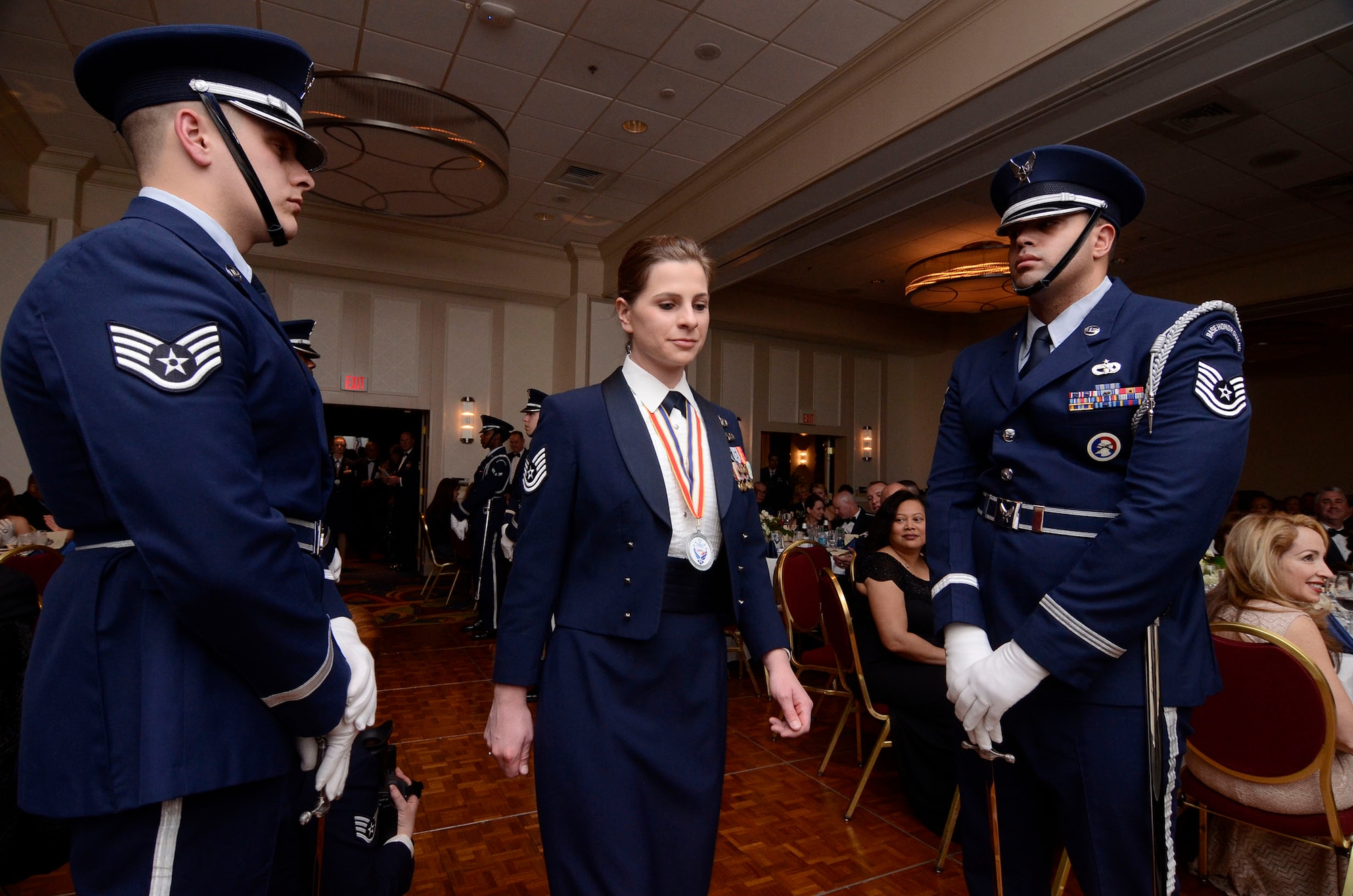 Tech. Sgt. Katherine Ring from the 80th Aerial Port Squadron enters the room as one of four Noncommissioned Officers of the Year nominees during the First Annual Dobbins Recognition Ceremony held in Marietta, Ga. Feb. 7, 2015. Ring was selected as the winner. The ceremony recognized individuals who demonstrated the capability to excel, and present themselves as the best of 2014.  (U.S. Air Force photo/Don Peek)