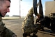 From left, Royal Air Force Warrant Officer Mark Taylor, Flt. Lt. Craig Rawlins and Senior Aircraftman Oliver Parsons, Joint Air Delivery trials and evaluations unit members, inspect a Humvee during training Jan. 20, 2015, on RAF Mildenhall, England. The RAF members worked with members of the 352nd Special Operations Support Squadron deployed aircraft ground response element to practice loading and unloading the Humvee in preparation for their upcoming joint training exercise, Emerald Warrior, held at Hurlburt Field, Fla. (U.S. Air Force photo by Senior Airman Kate Maurer/Released)