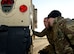Royal Air Force Senior Aircraftman Oliver Parsons, left, and Flt. Lt. Craig Rawlins, Joint Air Delivery trials and evaluations unit members, inspect a Humvee during training Jan. 20, 2015, on RAF Mildenhall, England. The RAF members worked with members of the 352nd Special Operations Support Squadron deployed aircraft ground response element to practice loading and unloading the Humvee in preparation for their upcoming joint training exercise, Emerald Warrior, held at Hurlburt Field, Fla. (U.S. Air Force photo by Senior Airman Kate Maurer/Released)